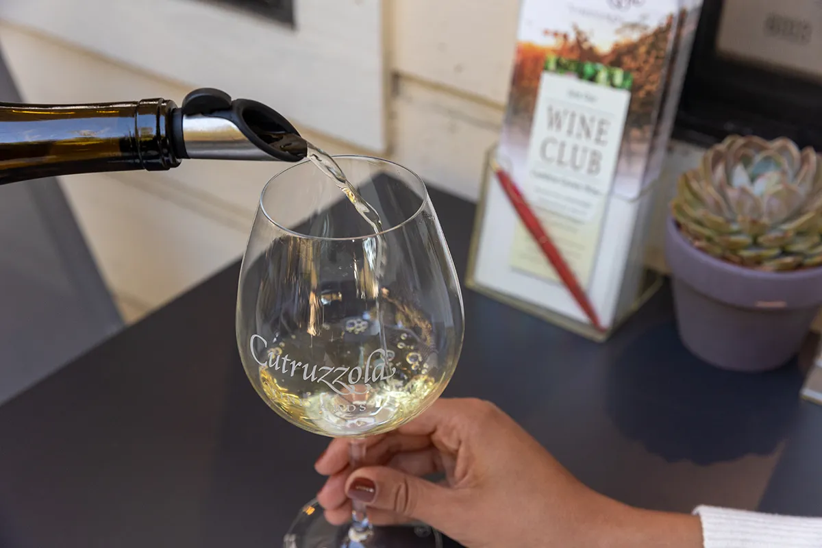 Cutruzzola white wine being poured into a wine glass