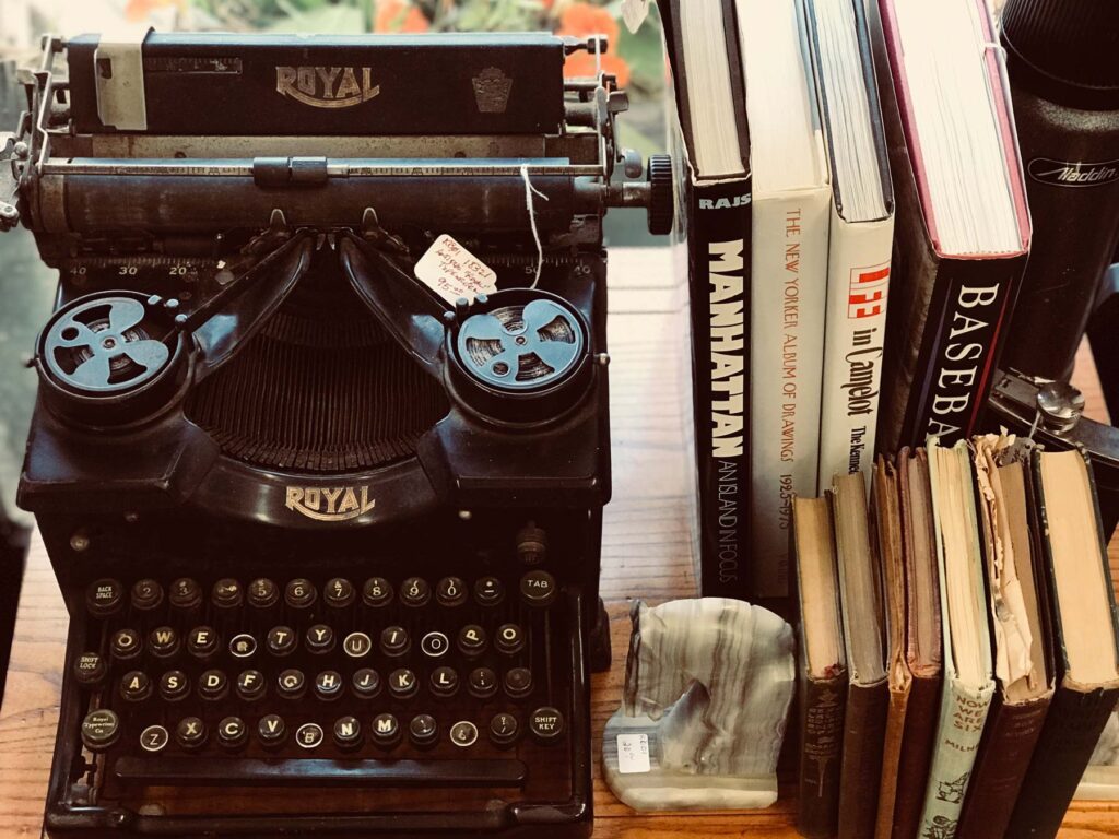 Antique typewriter and books