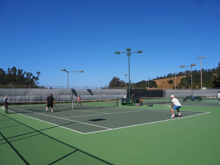 People playing tennis at the Cambria Tennis Club
