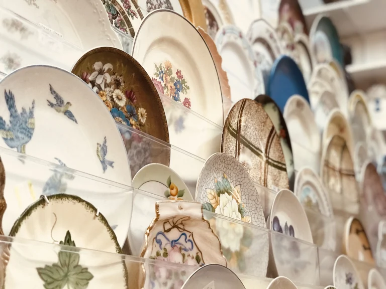 Vintage plates mounted on wall in an antique shop