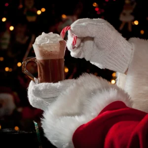 Santa holding a cup of cocoa