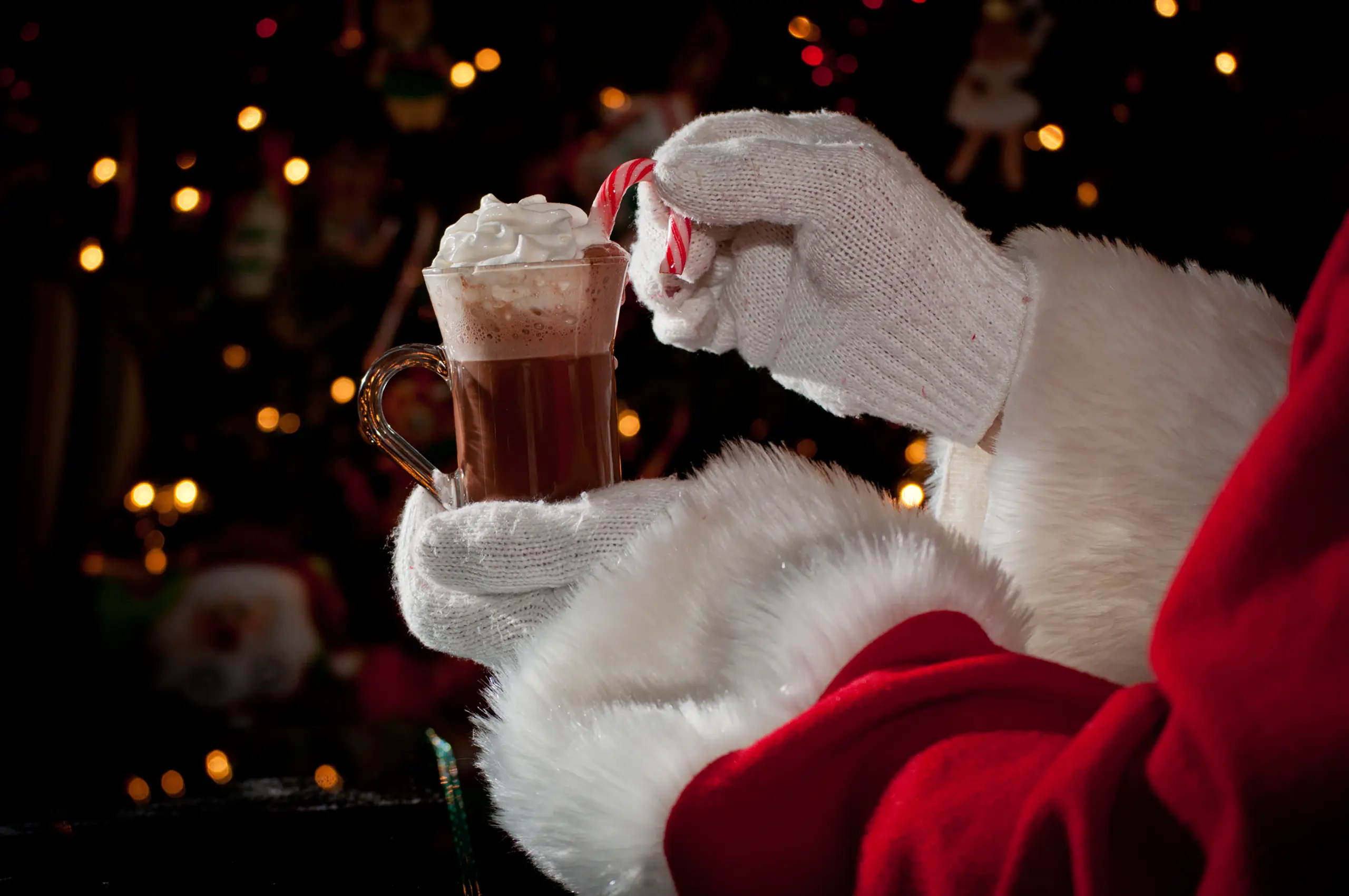 Santa holding a cup of cocoa